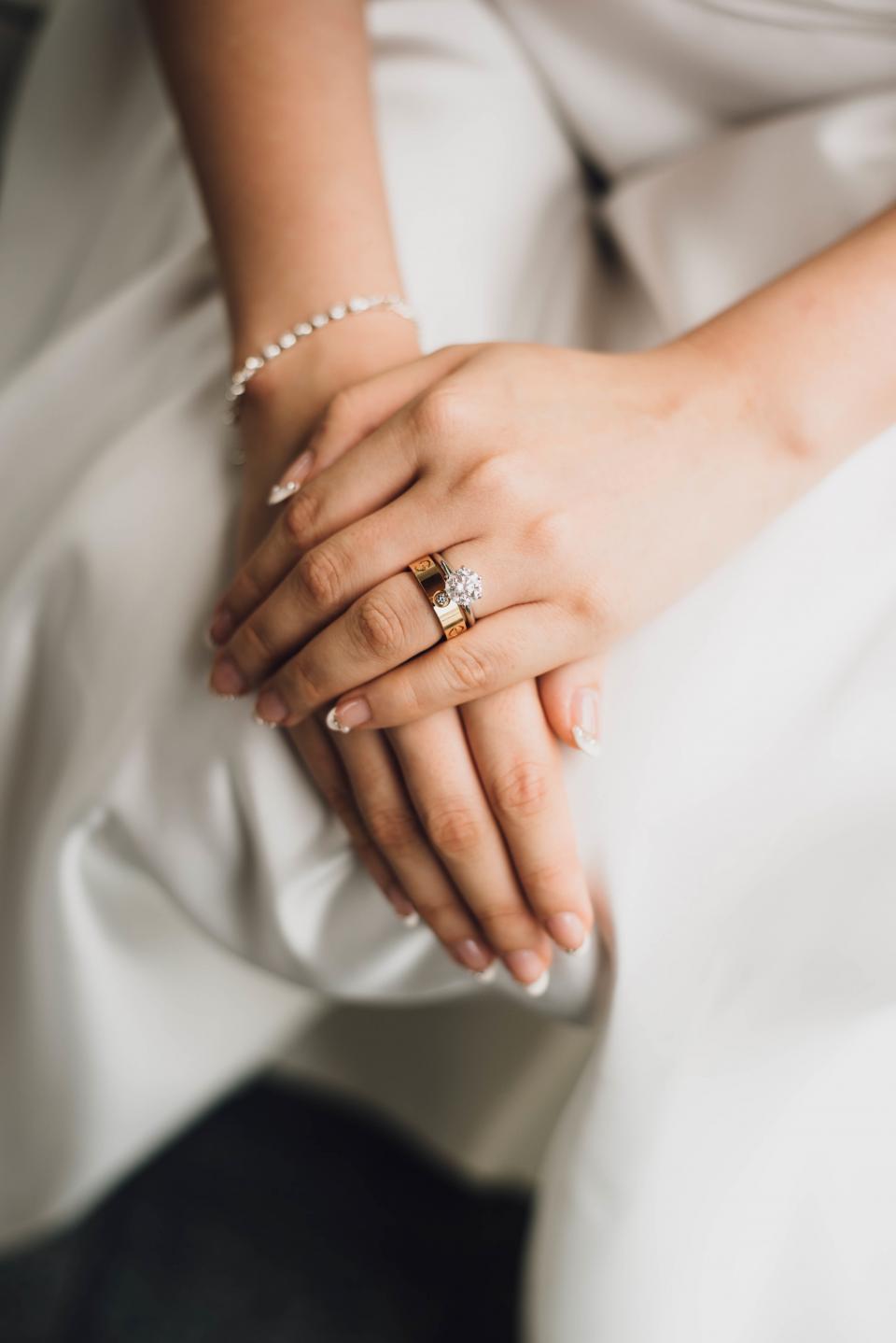 Bride's hands with gold rings